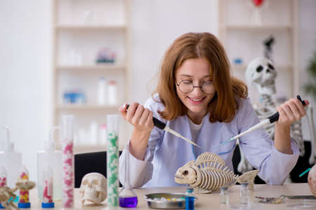 Young female zoologist working at the lab