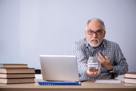 Old male teacher in retirement conceptの写真素材