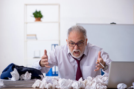 Old male employee in brainstorming conceptの写真素材