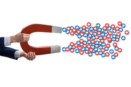 Businessman attracting likes with large magnet