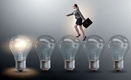 Businesswoman in new idea concept with light bulbの写真素材