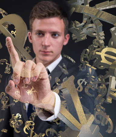 Businessman with various currencies in business conceptの写真素材