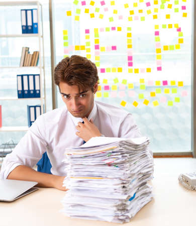 The busy businessman working in the officeの写真素材