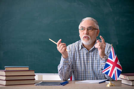 Old english language teacher in the classroom