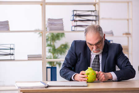 Old male employee in retirement conceptの写真素材