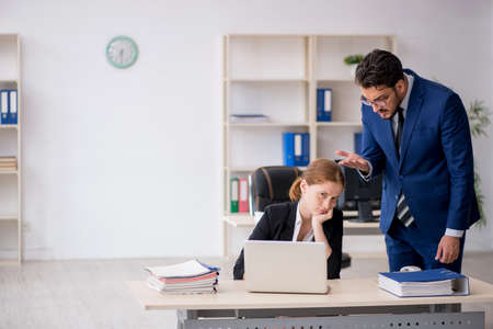 Two colleagues working in the officeの写真素材
