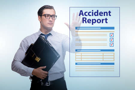 Businessman pressing buttons on virtual accident reportの写真素材