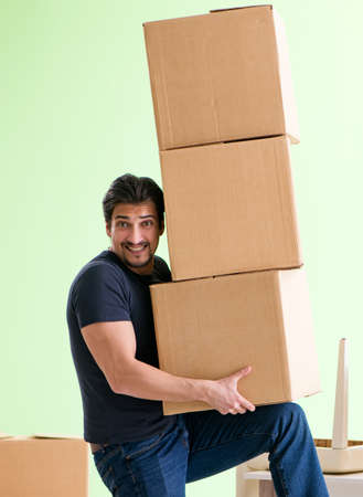 Man moving house with boxesの写真素材