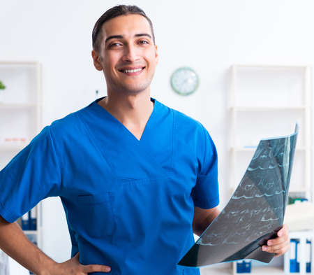 Young male doctor working in the clinicの写真素材
