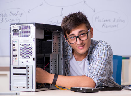 The young it specialist in front of the whiteboardの写真素材
