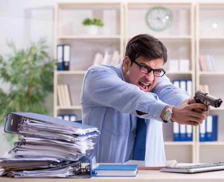 Stressful businessman working in the officeの写真素材