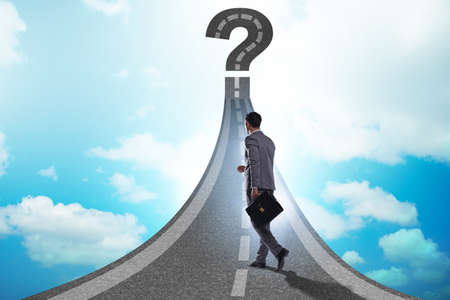 Concept of uncertainty with question and businessmanの写真素材