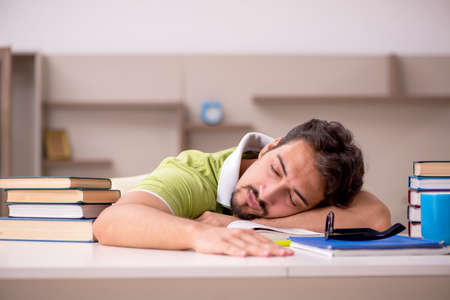 Young male student studying at homeの写真素材