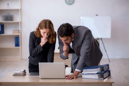 Two colleagues working in the officeの写真素材