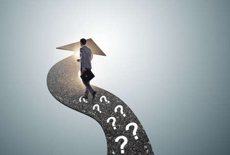 The businessman walking away on question footpath