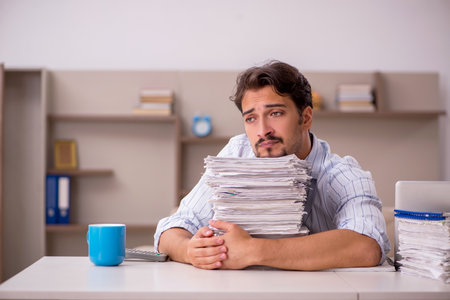 Young businessman employee working from home during pandemicの写真素材