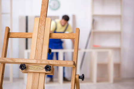 Young male carpenter working at workshopの写真素材
