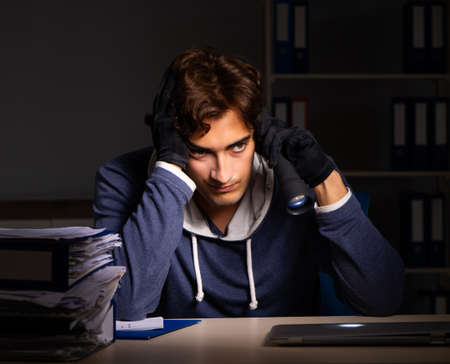 The thief trying to steal personal data in identity theft concepの写真素材