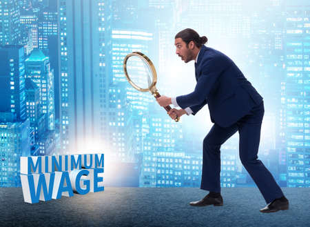 Concept of minimum wage with businessmanの写真素材