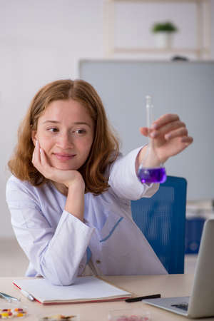 Young female chemist working at the labの写真素材