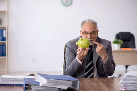Old male employee in retirement conceptの写真素材