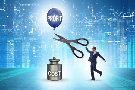 Concept of profit and cost with businessmanの写真素材