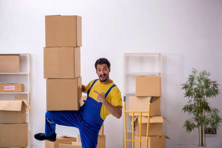 Young male contractor doing home relocationの写真素材