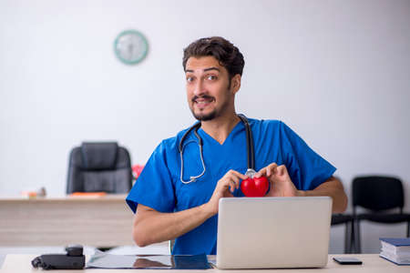 Young male doctor cardiologist working in the clinicの写真素材