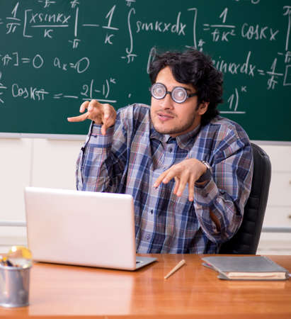 Funny male math teacher in the classroomの写真素材