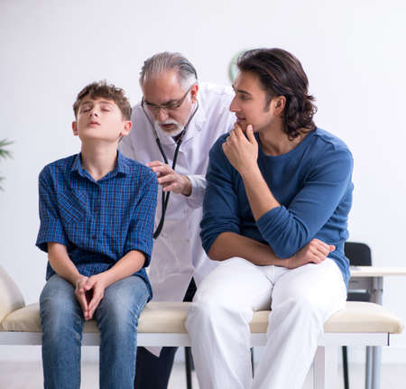 Young boy visiting doctor in hospitalの写真素材