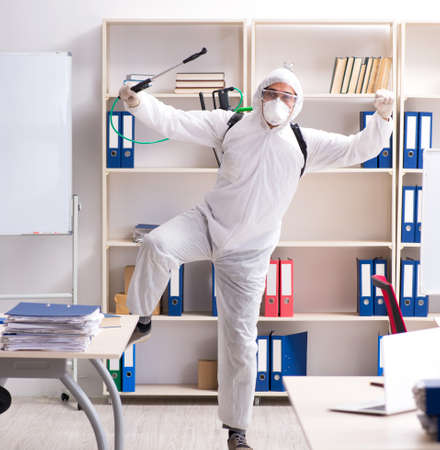 The professional contractor doing pest control at officeの写真素材