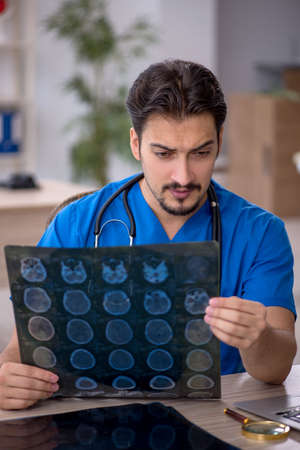 Young male doctor radiologist working in the clinic