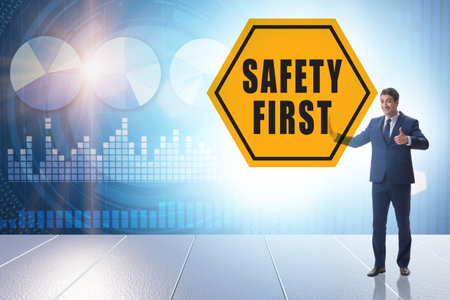 Safety first concept with businessmanの写真素材