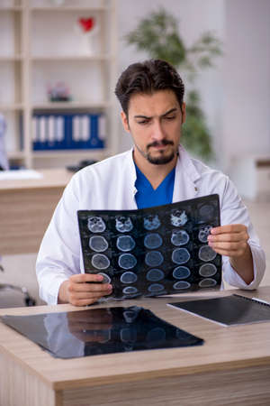 Young male doctor radiologist working in the clinicの写真素材