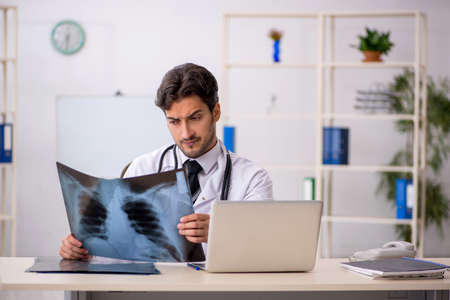 Young male doctor radiologist working in the clinic