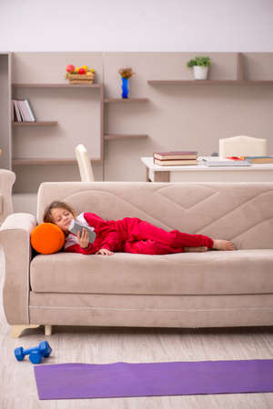 Young little girl staying at home aloneの写真素材