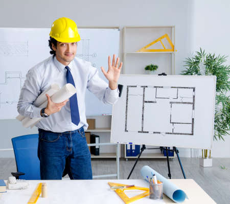 The young handsome architect working on the project