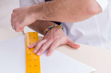 Architect working in his studio on new project