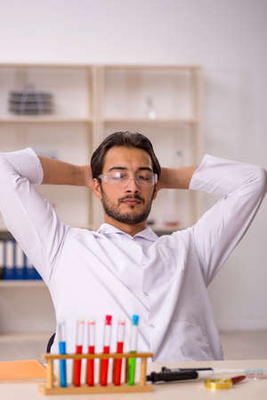 Young male chemist working at the labの写真素材