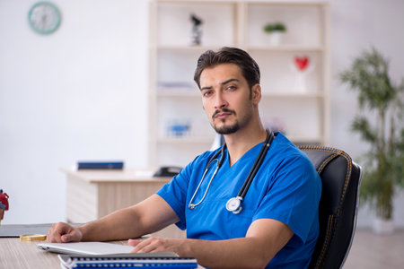 Young male doctor working in the clinicの写真素材