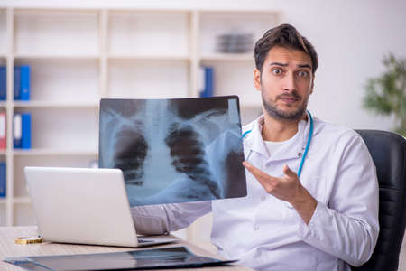 Young male doctor radiologist working in the clinic