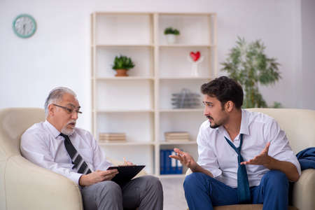 Young businessman employee visiting psychologistの写真素材