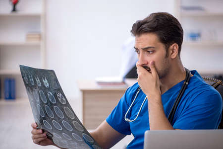Young male doctor radiologist working in the clinic