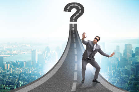 Concept of uncertainty with question and businessmanの写真素材