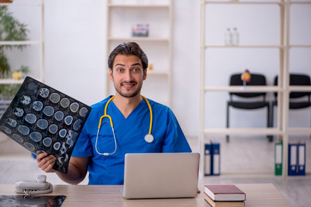 Young male doctor radiologist working in the clinic