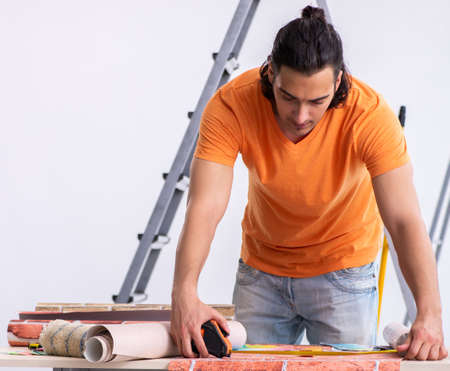 Young man contractor doing renovation at home