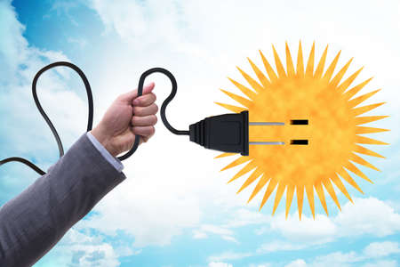 Solar energy concept with sun and socket