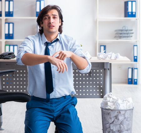 Businessman rejecting new ideas with lots of papersの写真素材