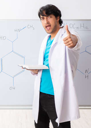 Young student chemist in the classroomの写真素材