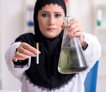 Female chemist in hijab working in the labの写真素材